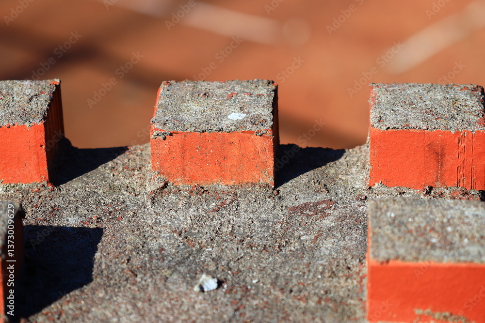 Poster A close-up view of a red brick with a small white dot in the center.