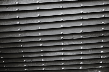 Obraz premium A close-up shot of a worn wooden wall with a distressed finish.