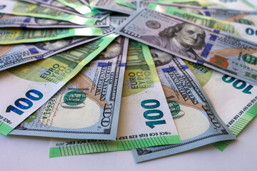 One hundred dollar bills of Euro and Dollars close-up