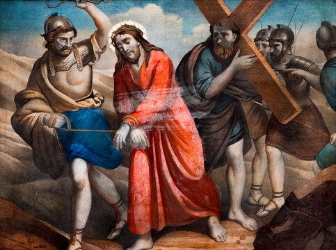 Painting (early 20th century) of The Way of the Cross. Fifth station: Simon of Cyrene helps Jesus carry his cross.