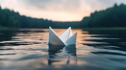 White Paper Boat Floating on Calm Lake at Sunset