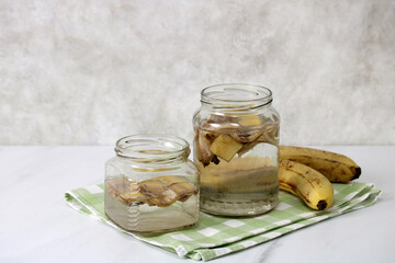 Making banana peel water as organic fertilizer for houseplants. copy space