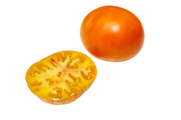 Yellow, orange tomato whole and cut in half, on white background. Fresh and ripe. Side view