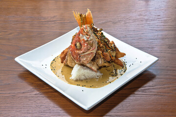 Huachinango curry, freshly prepared whole red snapper or snapper Thai style with tamarind sauce and...