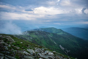 cloudy sunrise on Babia Góra with a view of the surrounding valleys