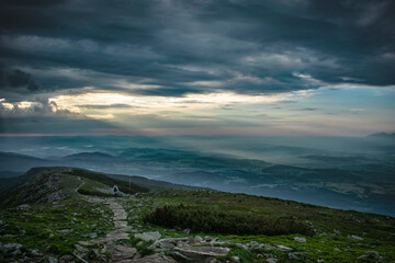 cloudy sunrise on Babia Góra with a view of the surrounding valleys