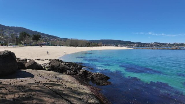 Serene Beach with Tranquil Clear Waters and Sand in Bueu