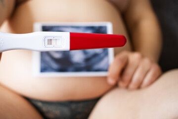Positive pregnancy test and baby ultrasound