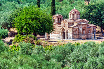 Byzantine monastery among olive trees in Greece