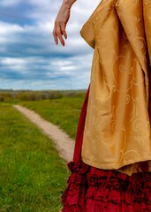 Fototapeta premium A woman wearing a dress from a past era.