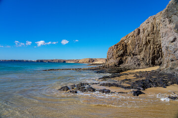 Rocky and sea area in a peaceful environment, surf on the sand of la Cera beach in Lanzarote-Canary Islands-Spain