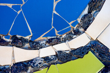 Pieces of tiles of different patterns and bright colors forming abstract figures. Pieces of tiles of different patterns and bright colors forming abstract figures, Cesar Manrique.