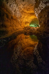 Reflection of ceiling in water of lava tunnel Cueva de los verdes on island of Lanzarote-Canary Islands-Spain