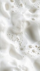 A close up shot of a foamy white surface texture