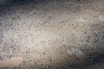 Surface of old concrete cracked gray wall with natural shadows. Abstract background