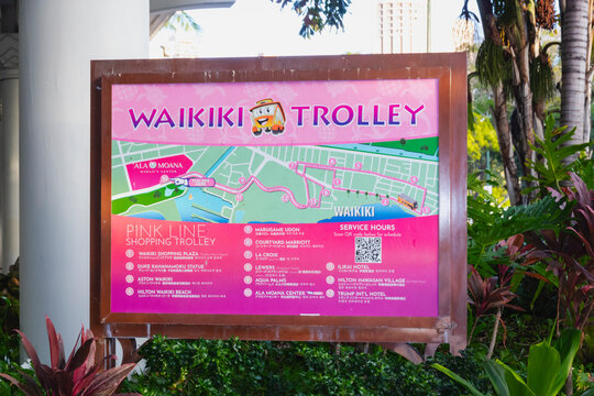 Information board for the Waikiki Trolley Pink shopping line showing a map of the trolley route between Waikiki Shopping Plaza and the Ala Moana Center.