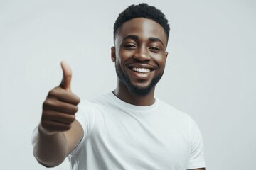 Cheerful African American man giving a thumbs up gesture with a bright smile
