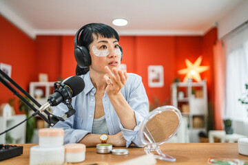 japanese woman hosts a show about skin care product at home studio