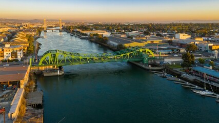 Aerial view of the  Park Street Bridge, Alameda, California, USA, with boats docked in the...