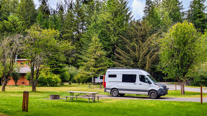 RV camping van parked at campsite of scenic Silver Falls State Park in Oregon