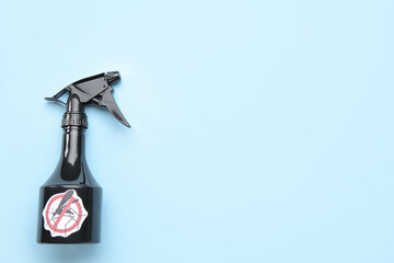 Mosquito repellent spray on blue background