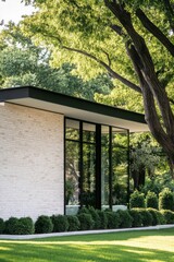 Contemporary architectural design prominently features sleek glass elements that beautifully integrate with natural surroundings, all set in a vibrant, sunlit outdoor environment