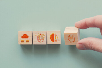 Hands holding IoT, internet of things, ai artificial intelligence icons, future smart city concept

