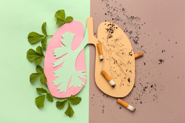 Paper lungs with cigarettes and leaves on color background