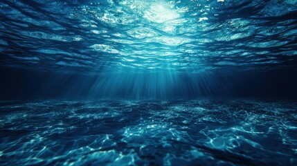 Sunlight streams through the surface of deep ocean waters