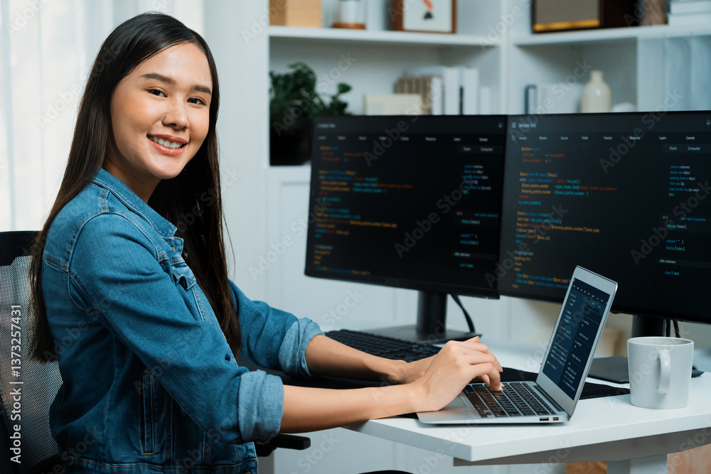 Poster young asian in it developer looking at camera to present with online information on pc with coding p
