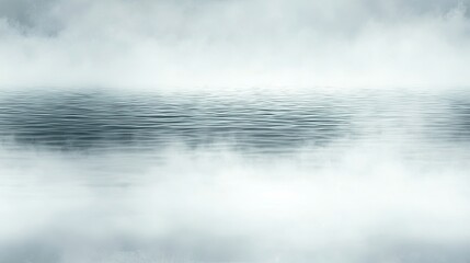 Serene body of water enveloped in mysterious fog creating an ethereal atmosphere and enhancing the sense of tranquility in nature