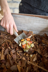 Organic waste and dried leaves in a composting process