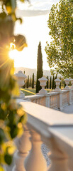 Sunset Garden Landscape with White Balustrade and Cypress Trees