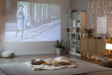 Living room with tasty snacks prepared for watching movie at home in evening
