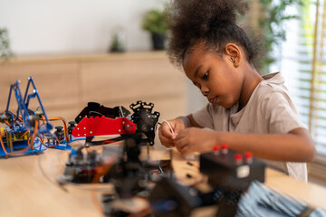 Portrait happy kid african girl having fun hobby leisure lifestyle activity learn and skill brain...