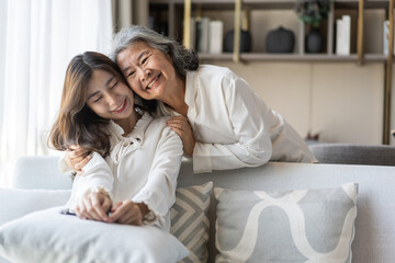 Portrait of enjoy happy love asian family senior mature mother and young daughter smiling play...