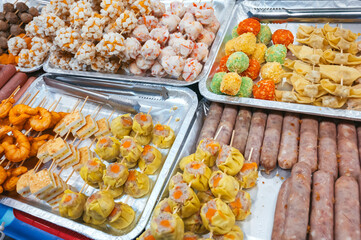 Fast food at Asian night market in Asia. Traditional Vietnamese street food on counter in Vietnam in Da Nang