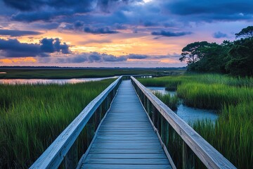 boardwalk at a coastal marsh sunset tranquility, ease of access, and a strong bond between visitors and surrounding natural environment, including marsh grasses and aquatic life