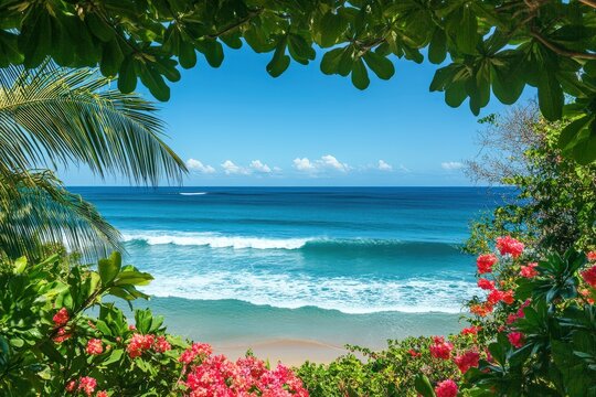 Idyllic tropical beach view framed by vibrant flowers and palm trees.