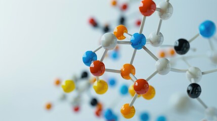 Detailed shot of a molecular model kit with colorful atoms and bonds, set against a plain background for clarity.