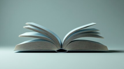 Fototapeta premium An open book with blue pages resting on a flat surface, showcasing its intricate spine and detailed paper edges.