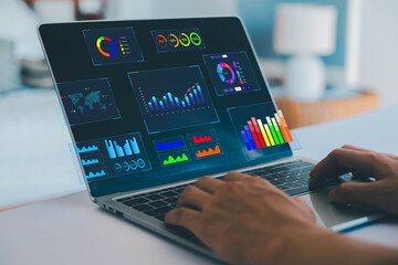 Analyst using laptop to analyze data. shows a dashboard chart for business data analysis and...