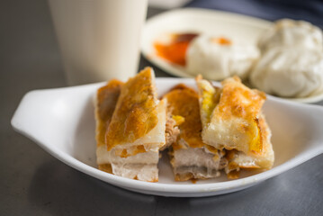 Crispy stuffed pancake served with dumplings