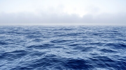 Fototapeta premium Stormy Sea with Rolling Waves and Misty Grey Sky