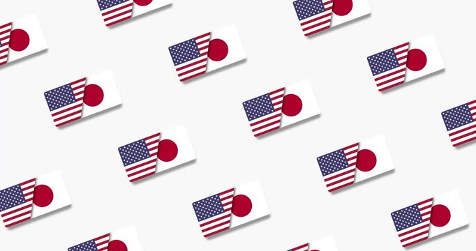 Looping video animation of the American and Japanese flags moving sideways on a black and white background.