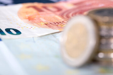 European economy and close-up of many euro banknotes and coins	