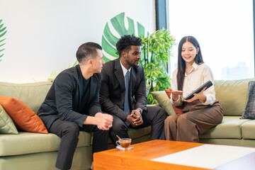 Businesswoman insurance agent presenting health or auto insurance policy details to businessmen, risk assessment and coverage consultation, financial planning, protection, security and investment