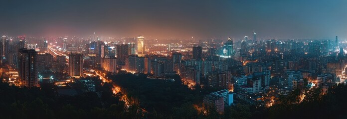 Obraz premium Cityscape at Night with Illuminated Buildings and Dark Sky