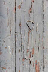 Grey paint pealing off timber door