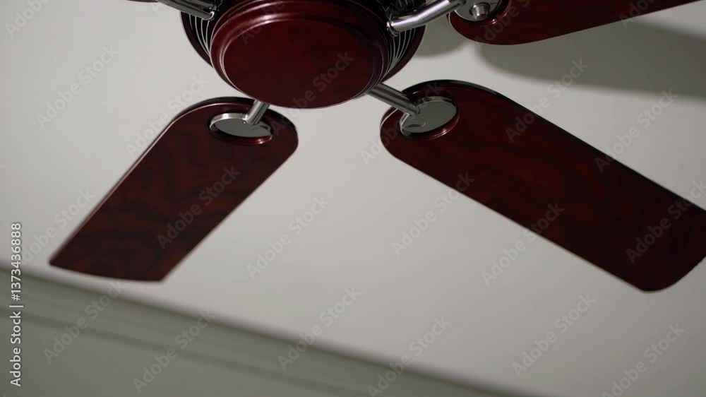 Poster elegant ceiling fan rotation on a minimalistic background captured in motion